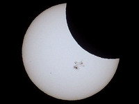 Eclipse of the Giant Sunspot