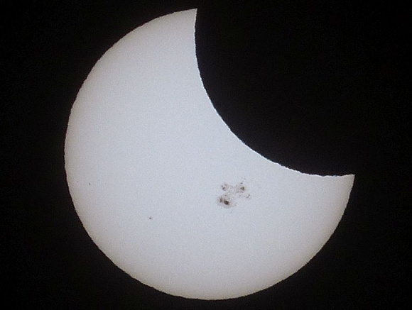 Eclipse of the Giant Sunspot